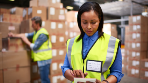 Woman in logistics organises warehouse